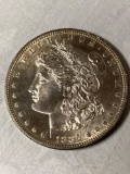1885-S Morgan dollar, AU.