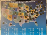 Commemorative quarters of the Fifty States collector's map w/ coins.