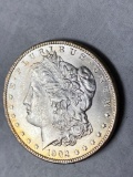 1902-O Morgan dollar, AU.