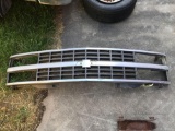 Chevy front grill cover off '90s