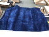 Blue shag area rug 7.5 feet by 9 feet