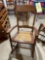 Cane seat pressed back rocking chair