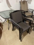 Glass top patio table with 4 chairs. 2 patio chairs with foot stools