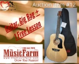 Auction Item 12 Guitar, Gig Bag & 1 Free Lesson at the Music Farm Valued at $250