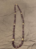 Amethyst beaded necklace with 14 karat yellow gold clasp