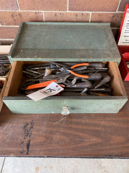 Green wood drawer with files, pliers, chisels