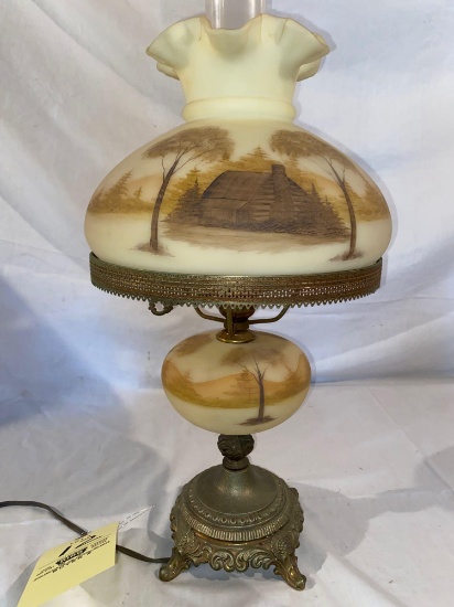 Fenton lamp w/ log cabin scene painted by Gloria Fina, 20" tall.