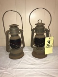 Two Barn Lanterns with red shades