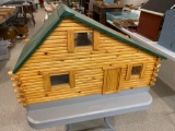 Log cabin dollhouse and furniture with stone fireplace