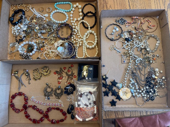 (3) Boxes of costume jewelry.