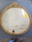 Round gold frame mirror