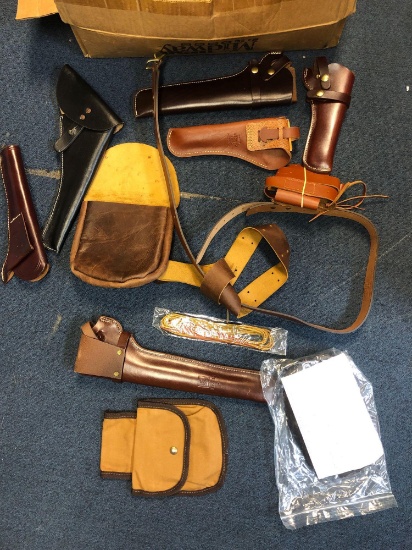 Box of leather holsters, belt, purses, etc