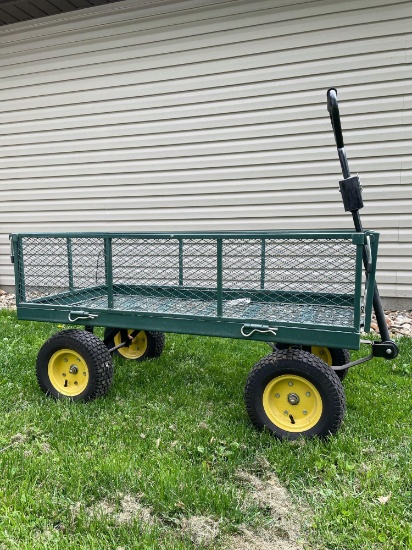 Like new 4 wheel utility yard cart with drop down side