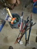 Tool bucket, ratchet straps, levels, limb loppers, machete, rakes
