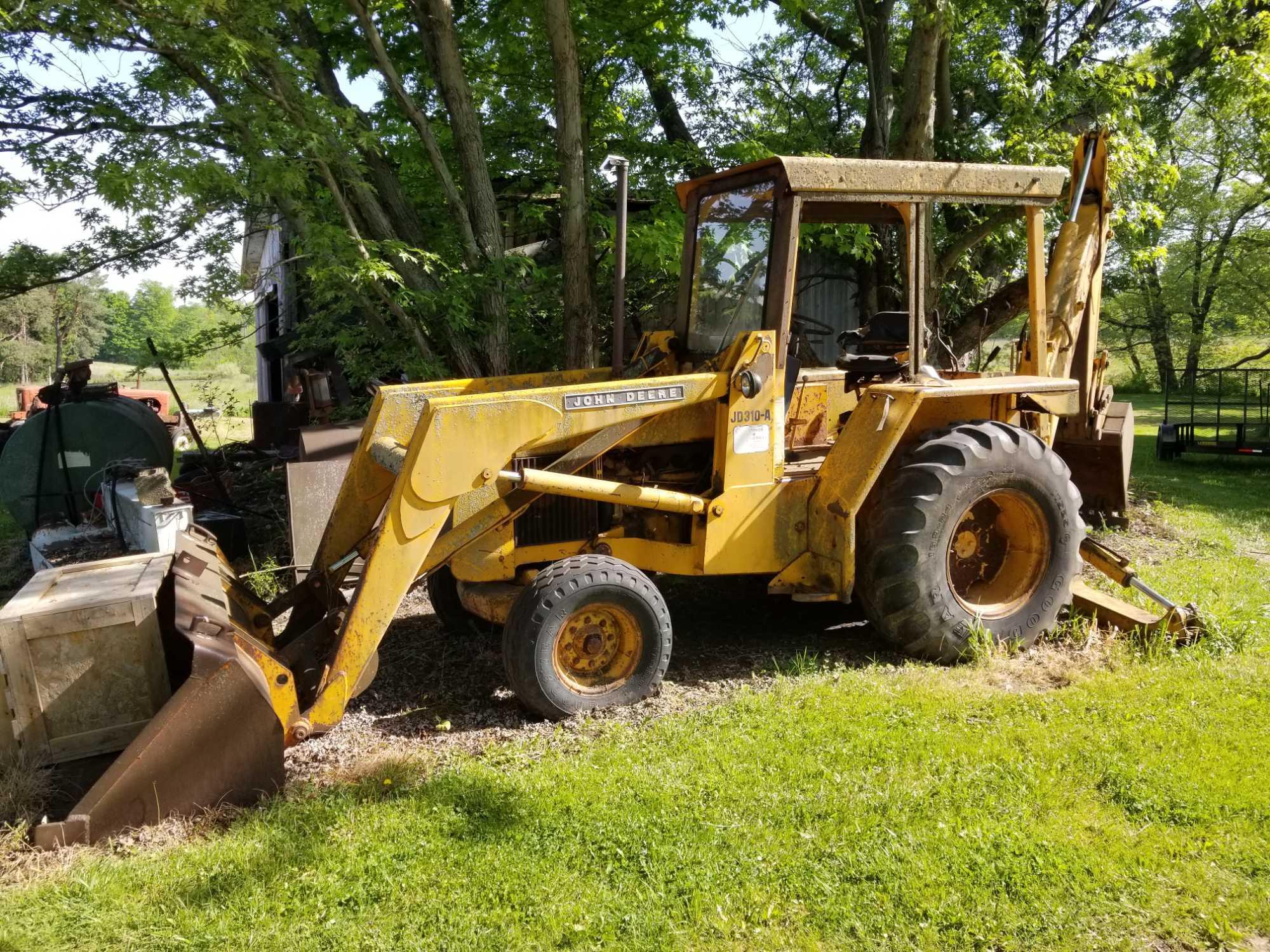 John Deere 310A backhoe loader, runs, has Proxibid