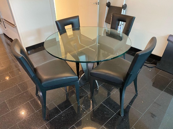 Heavy glass top table with steel base, 4 chairs by Dakota Jackson