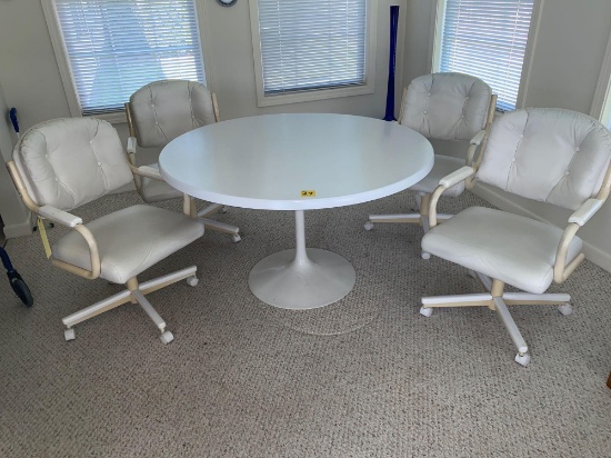 Table w/ set of four Chromecraft swivel chairs, 48" diameter.