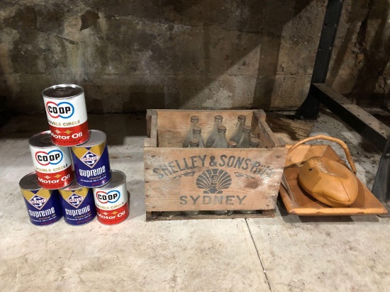 Oil cans, wood crate, bottles, etc.