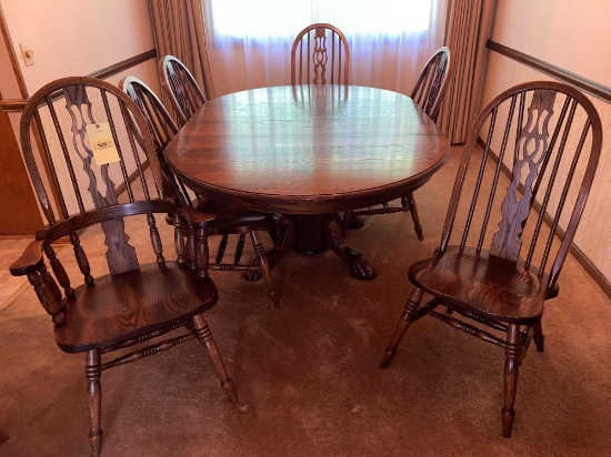 Claw footed oak extension table w/ six chairs.