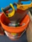 5 gallon bucket with saws, marbles, other miscellaneous tools