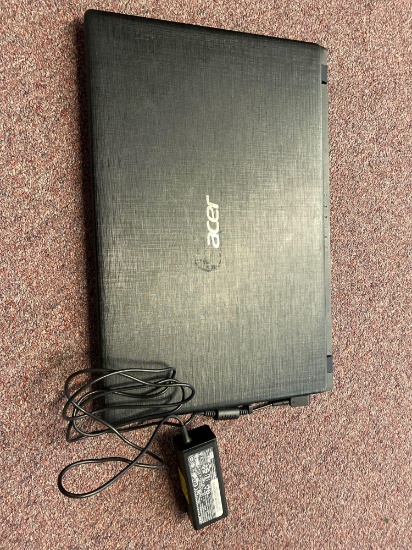 Acer laptop with part of power cord