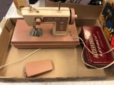 Miss Durham child sewing machine