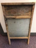 Vintage glass washboard with advertising