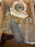 Old glass bottles, clock, silver plate utensil