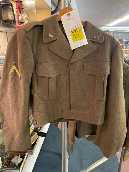 Vintage military jacket with patches and pins