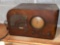Silvertone radio. Piece of veneer missing on speaker, needs cleaned.