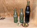 (3) Coca-Cola bottles, (2) political buttons.