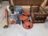 Coleman lantern, concrete rabbit, ceramic frog, sprinkler can, bucket, planter coasters.