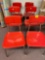 6 red retro chairs