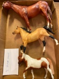Three Breyer horses