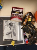 Baseball gloves, Pepsi bottle, baseball book, and framed picture