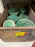 Wooden crate full of green McCoy planters
