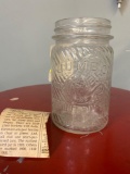 Very cool old jumbo peanut butter jar with newspaper clipping about jar
