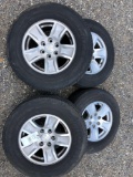 Set of 4 tires and wheels from a Chevy truck