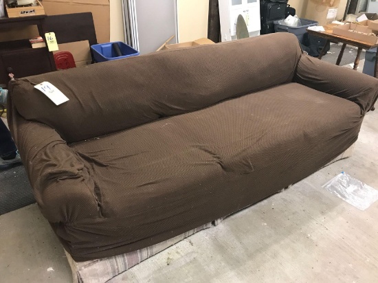 Sofa with brown slip cover