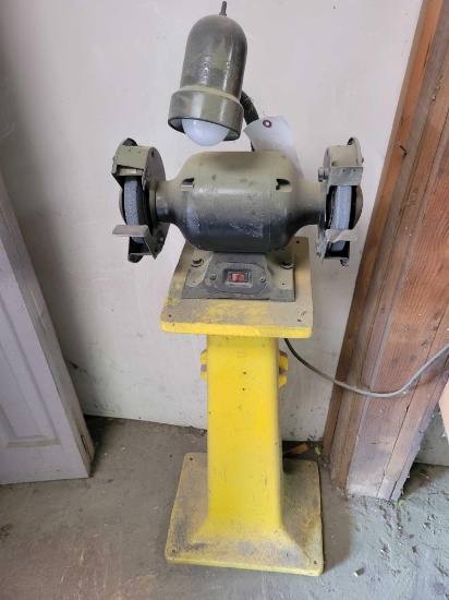 Bench grinder with heavy pedestal base