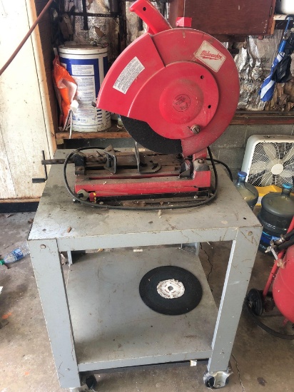 Milwaukee chop saw on rolling stand.
