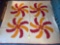 76 in. x 82 in. red and orange quilt