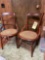 Two antique hip hugger chairs with cane bottoms