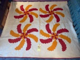 76 in. x 82 in. red and orange quilt