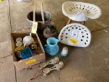 Americana basket, tractor seats and chair, glassware, bell, early skates, vase, lamp base