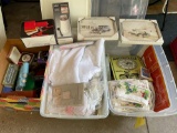 Tote full of linens and curtains, car pictures, towels, gift items, lamp, coffee bean grinder, clock