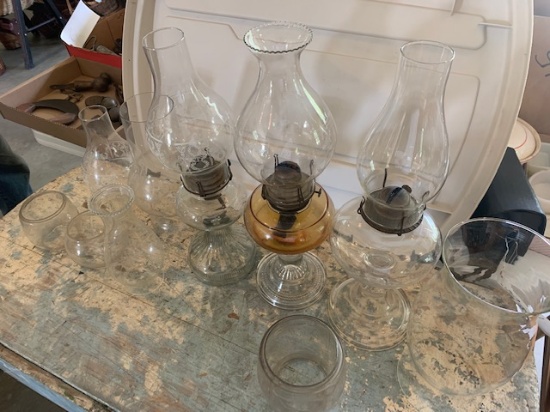 Three Oil lamps and extra chimneys