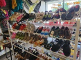 3 shelves of assorted shoes and sandals, various sizes