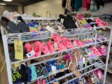 3 shelves of assorted shoes and sandals, various sizes