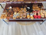 Shelf of assorted shoes and sandals, various sizes